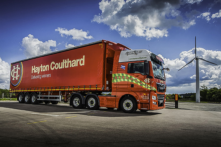 Hayton Coulthard lorry next to windmill.