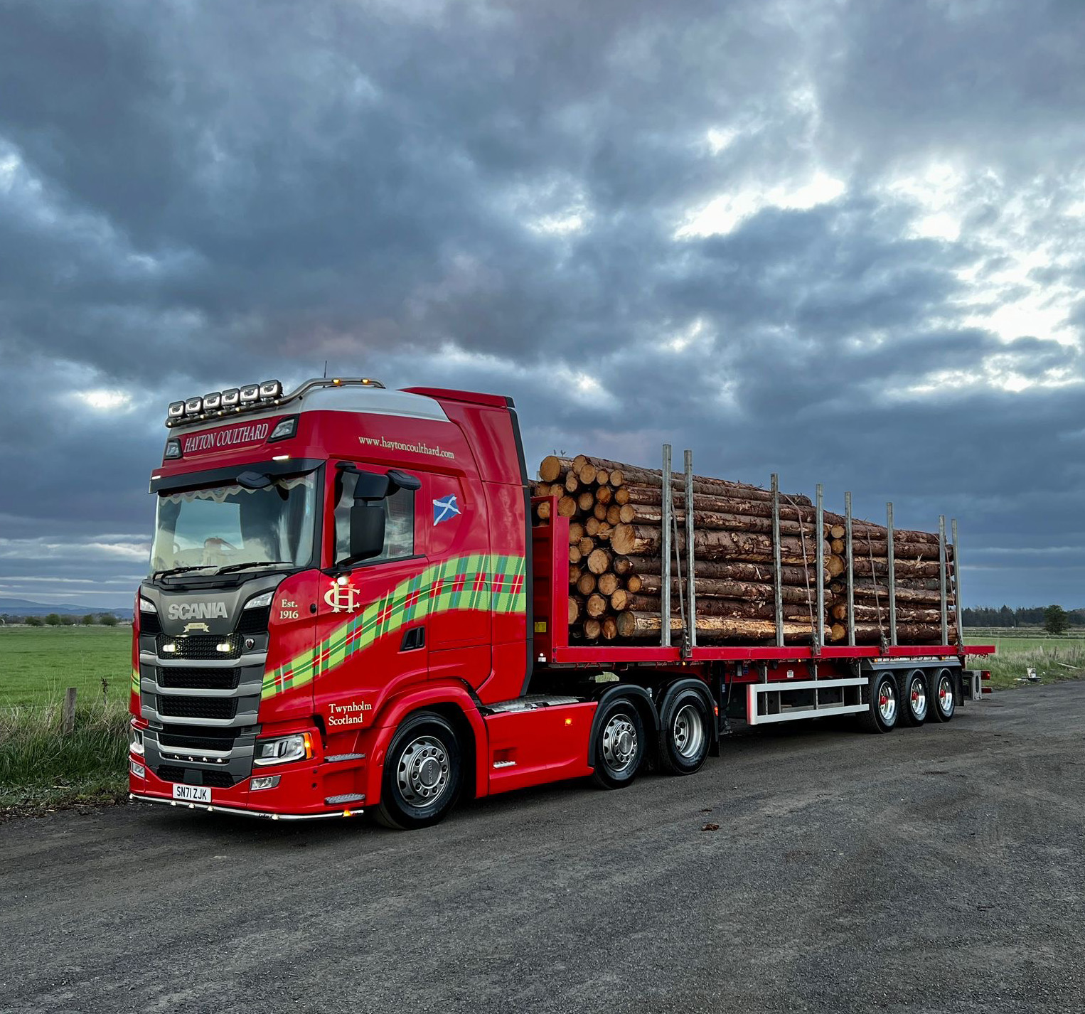 Hayton Coulthard flat bed trailer transporting logos.